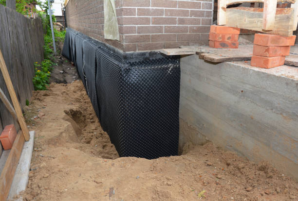 Happy homeowners after waterproofing job in Stony Brook